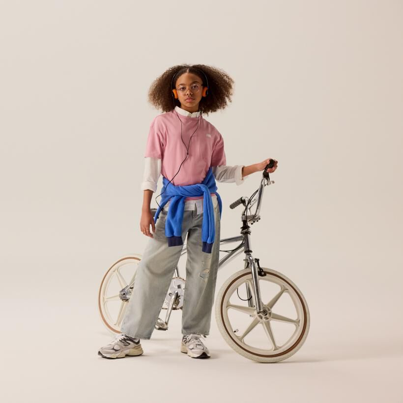 Kid leaning against the wall